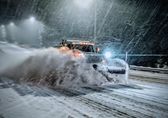 Transportation's Garry Kroshko plows Coal Creek Parkway Southeast at around 1 a.m. Saturday morning.