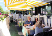 John and Carla Stratfold dine at Bis on Main's al fresco space with their friend Stacy Graven (back to camera).