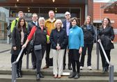 NTSB chair Jennifer Homendy (front row, second from right) takes a walking tour of Bellevue with Mayor Lynne Robinson (right, front row) and County Commissioner Claudia Balducci (second from left, front row).