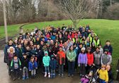 Volunteers pose after a park restoration project.