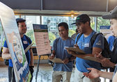 Residents participate in a housing forum at City Hall.